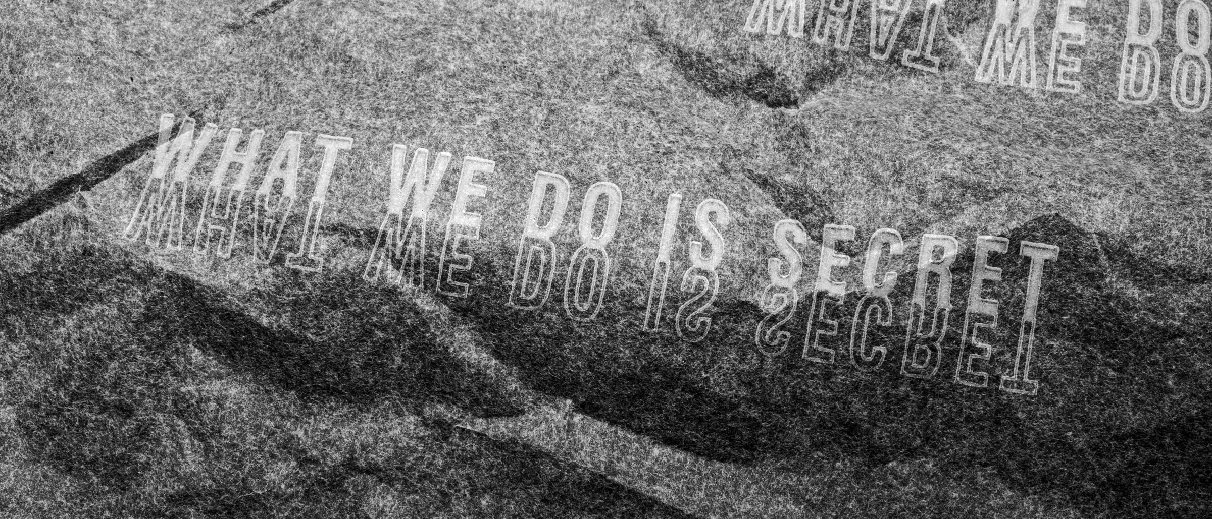 The name, embossed in stone